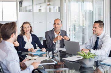 Business people meeting image discussing acquisition finance